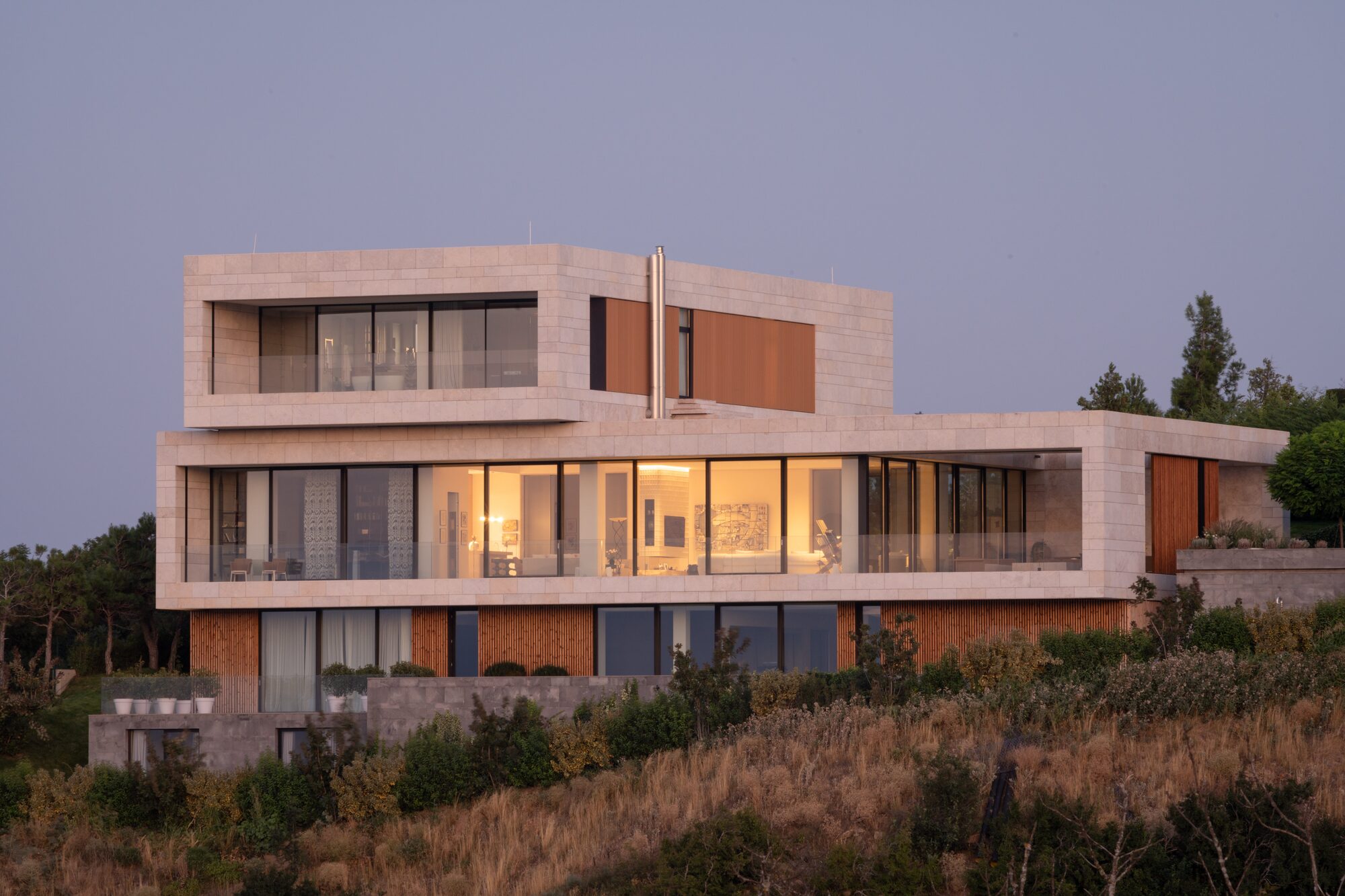 Private villa exterior at dusk